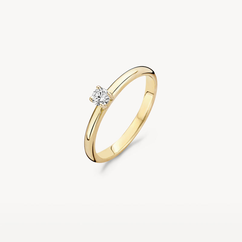 Bague solitaire en or jaune 14k avec zircone ronde, au design fin et subtil.