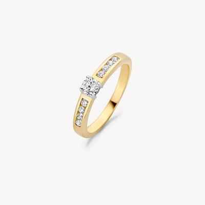 Bague en or jaune 14k avec zircone centrale et zircone incrustée dans la bande.