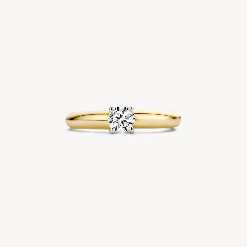 Ring met solitaire zirkonia in 14k geel goud en 14k wit goud band.