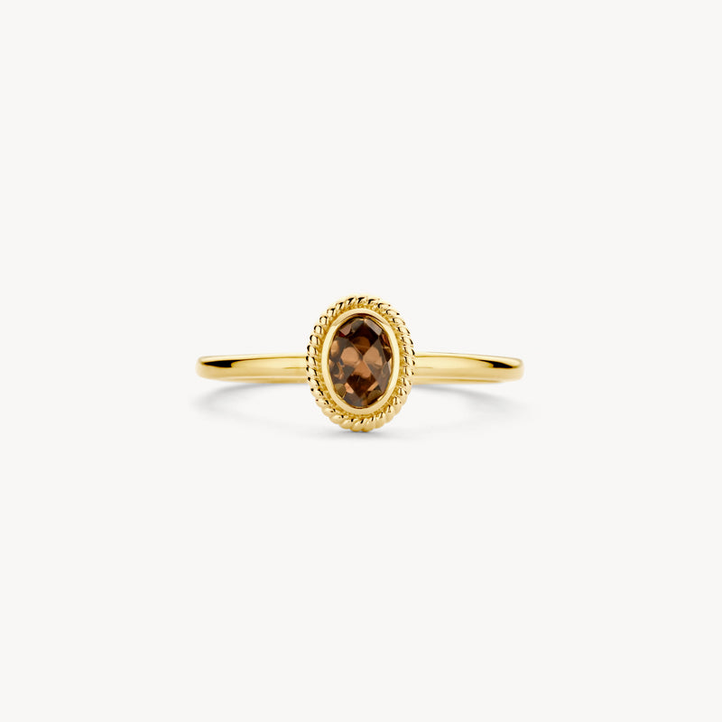 Ring aus 585er Gelbgold mit ovalem Rauchquarz und feinem Perlenrand.