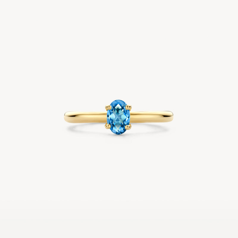 14k geelgouden ring met ovale blauwe topaas en simpele band.