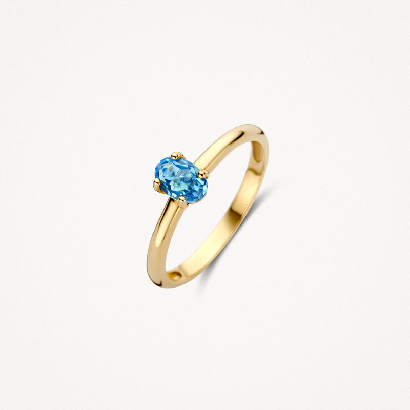 14k geelgouden ring met ovale blauwe topaas in solitair zetting.