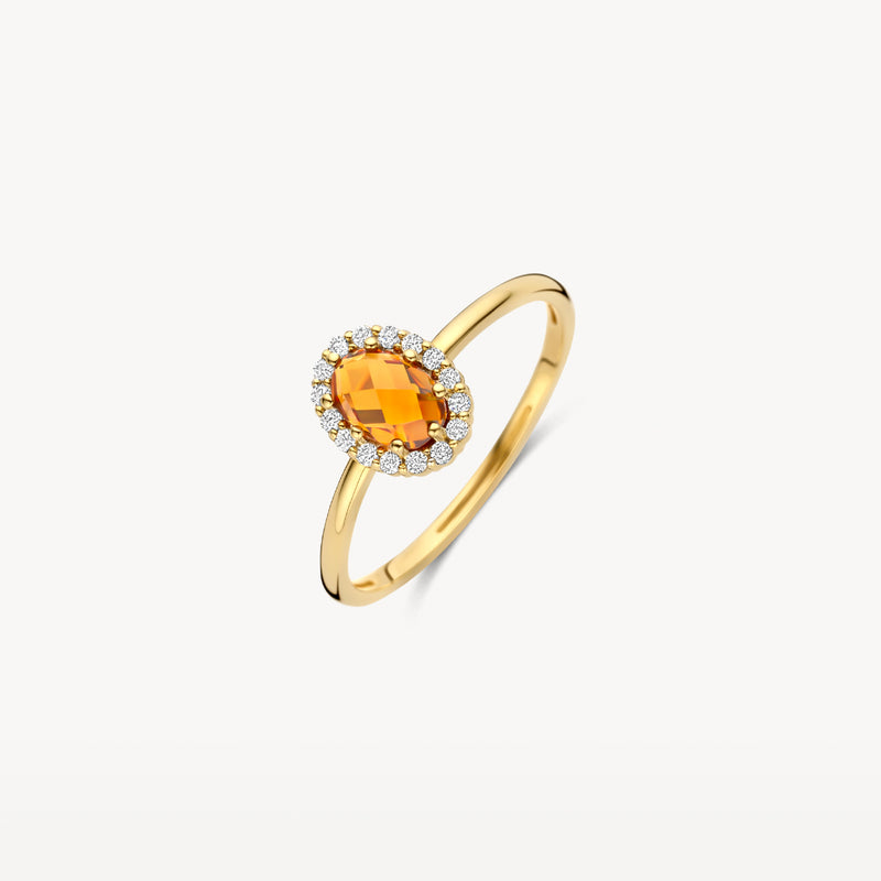 Bague en or 14k avec citrine ovale de Madère et petits diamants blancs sur le pourtour.