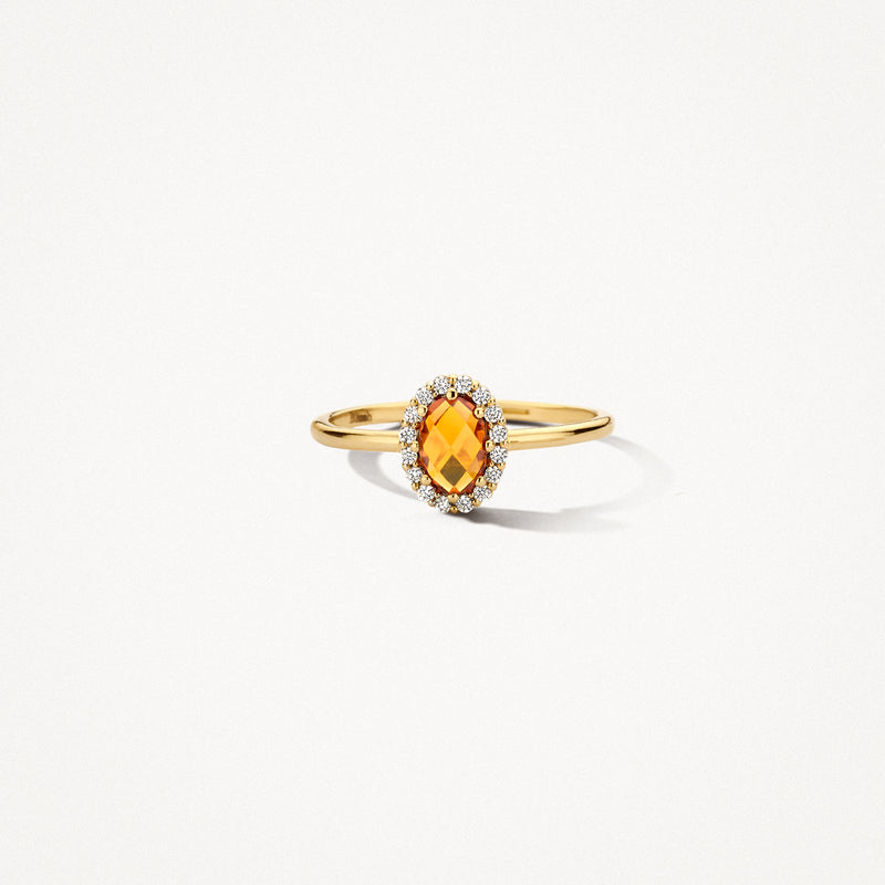 Bague en or 14k avec citrine ovale de Madère et petits diamants blancs sur le pourtour.
