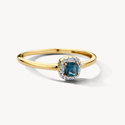 Bicolor ring met 14k geel goud en london blue topaz omringd door diamanten.