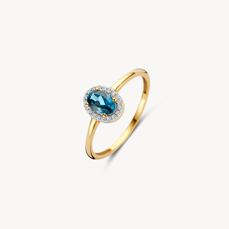 14k geelgouden ring met ovale blauw topaz en ronde diamanten halo.