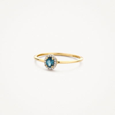 14k geelgouden ring met ovale London blauwe topaas en kleine diamanten halo.