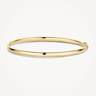Dunne gladde bangle van 14k geel goud met een glanzende afwerking.