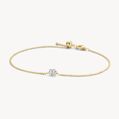 Bicolor armband van 14k goud met een stralende witgouden zirkonia schakel.