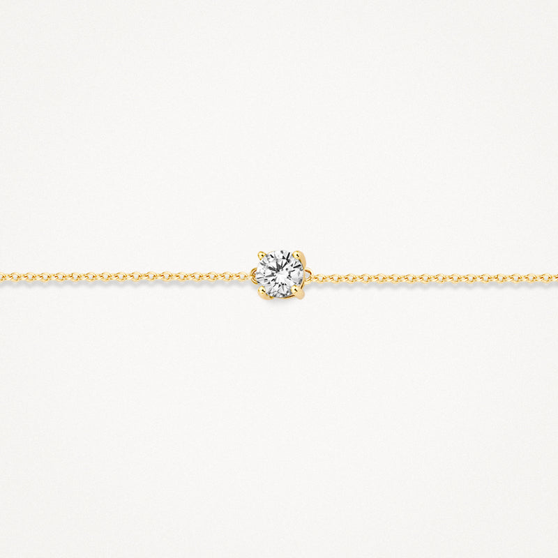 Bracelet en or bicolore avec maillons fins et zircone centrale en or 14k.