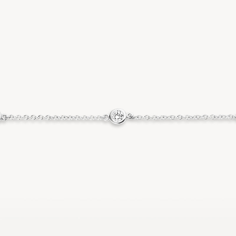 Fijne armband van 14k wit goud met kleine zirkonia in het midden.