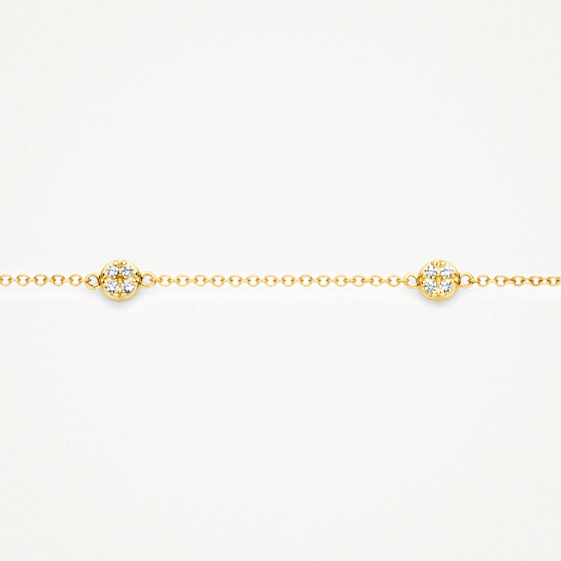 Fijne 14k geelgouden armband met kleine schakels en zirkonia bloemaccenten.