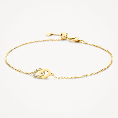 Armband van 14k geel goud met fijne schakels en bicolor gouden schakels met zirkonia's.