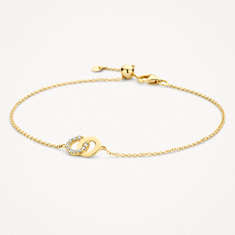 Armband van 14k geel goud met fijne schakels en bicolor gouden schakels met zirkonia's.
