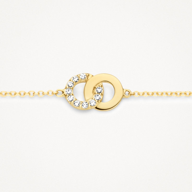 Armband met twee verbonden cirkels in 14k geel goud, één met zirkonia's, fijne schakel.
