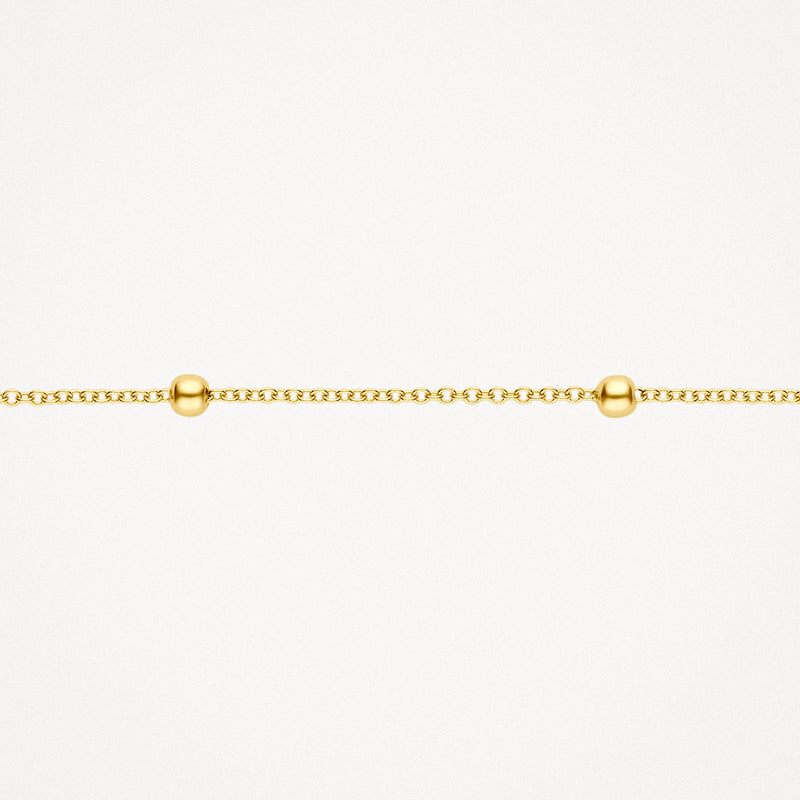 Fijne schakelarmband in 14k geelgoud met kleine bolletjes als detail.