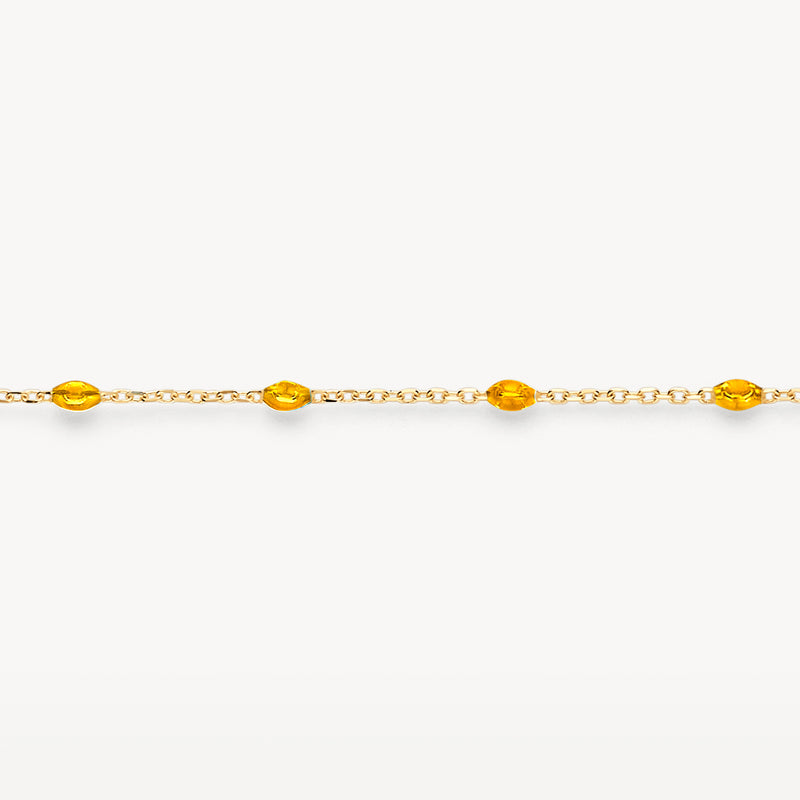 Bracelet en or jaune 14k avec des maillons fins et des accents en résine caramel.