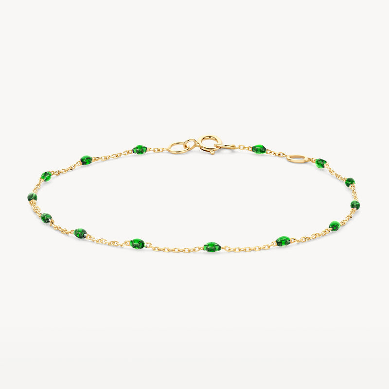 Armband van 14k geel goud met fijne schakels en groene resin stenen.