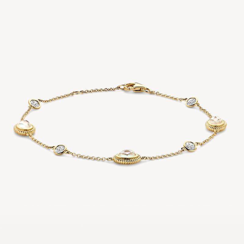 Armband in 14k geel goud met ronde rock crystal en zirkonia schakels.