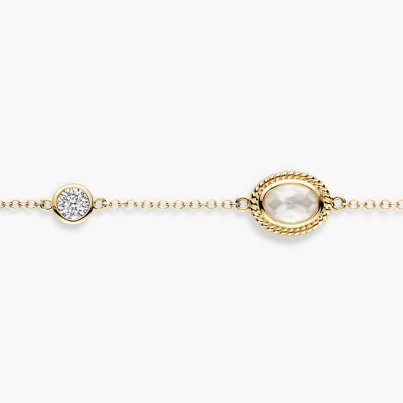 Armband aus 585er Gelbgold mit ovalem Perlmutt und Zirkonen mit Brillantschliff in feinen Gliedern.