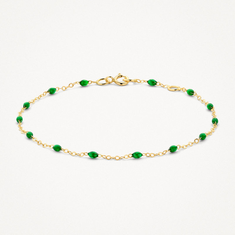 Bracelet en or 14k avec des maillons fins et des petites perles en résine verte.