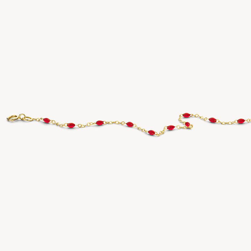 Bracelet en or 14k avec des maillons fins et des maillons en résine rouge.
