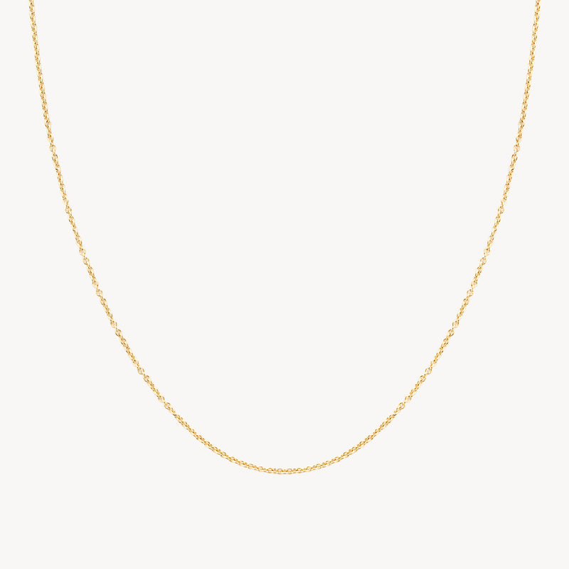 Dunne ketting van 14k geelgoud met fijne schakels, subtiel en minimalistisch.