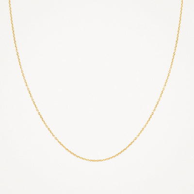 Fijne schakelketting van 14k geelgoud met subtiele glans.