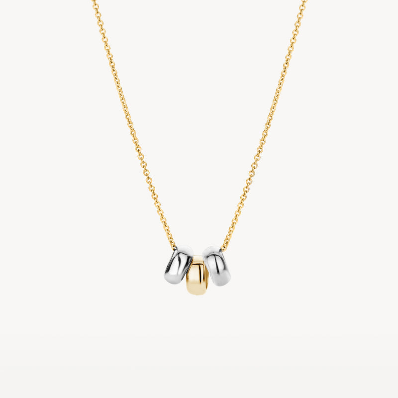 Bicolor ketting met schakels van 14k geel, wit en rosé goud, drie hangertjes.