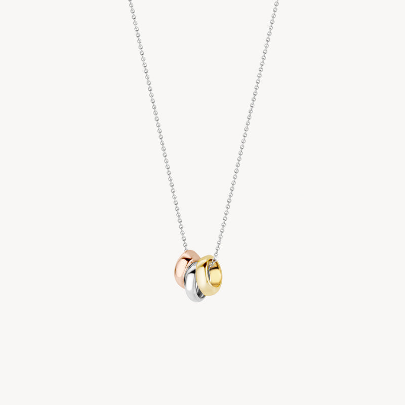 Collier bicolore avec trois bagues en or blanc 14k, or rose et or jaune.