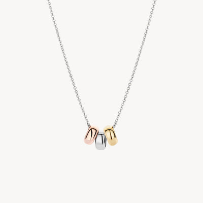 Bicolor goud ketting met hangers van 14k wit, rosé en geel goud aan fijne ketting.