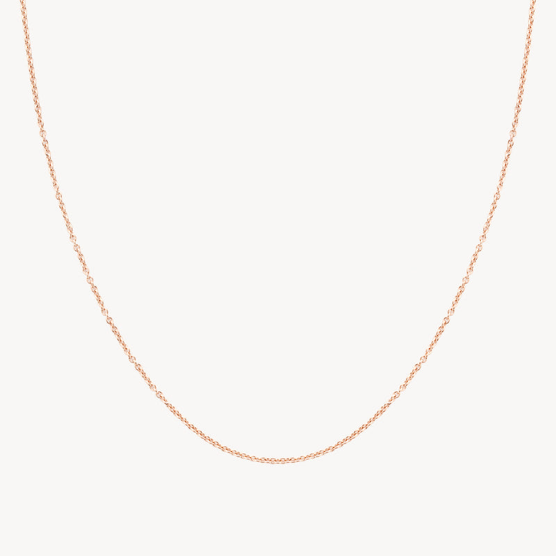 Fijne schakelketting van 14k rosé goud met subtiele glans.