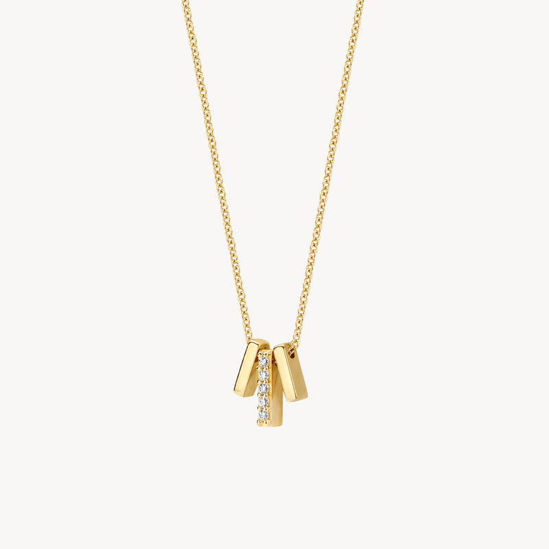 Collier délicat en or jaune 14k avec trois breloques en pendentif et des Zircones.
