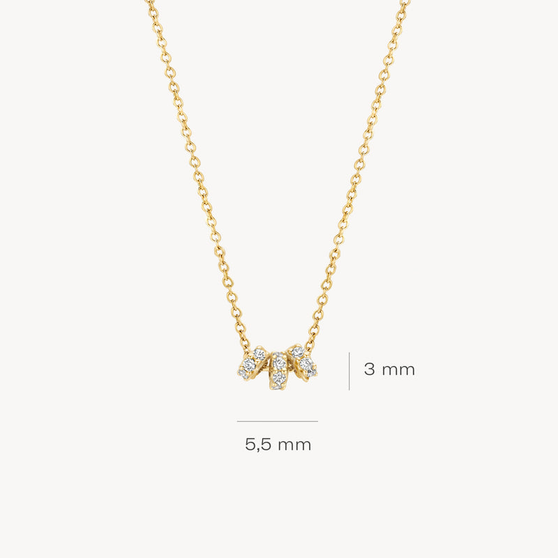 14k geelgouden ketting met drie kleine zirkonia hangers aan fijne schakelketting.