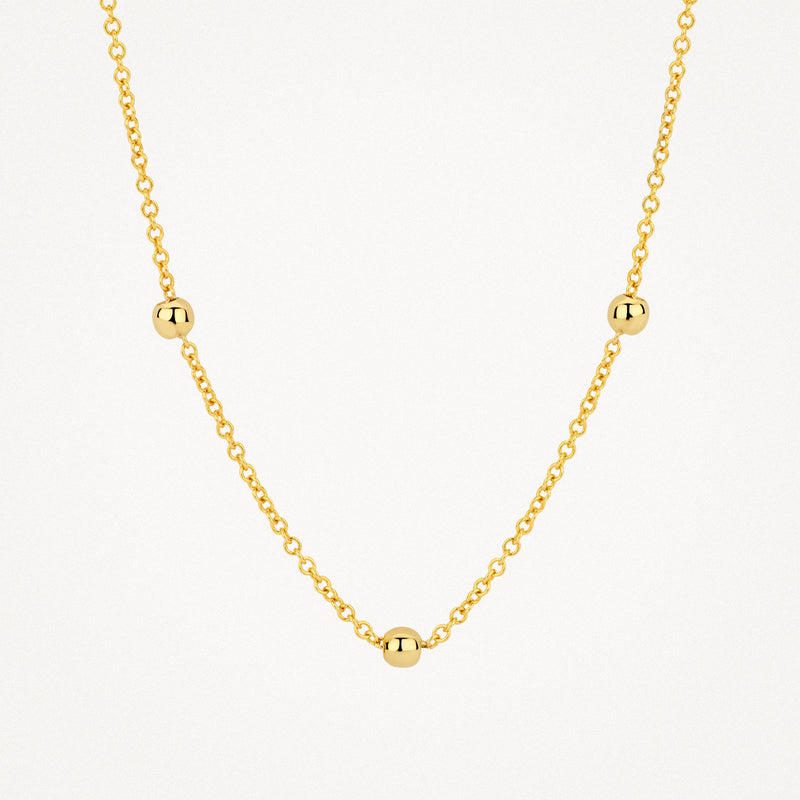 14k geelgouden ketting met fijne schakels en drie bolvormige elementen.
