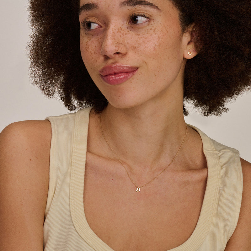 14k geel goud halsketting met fijn schakelhartje in bicolor goud.