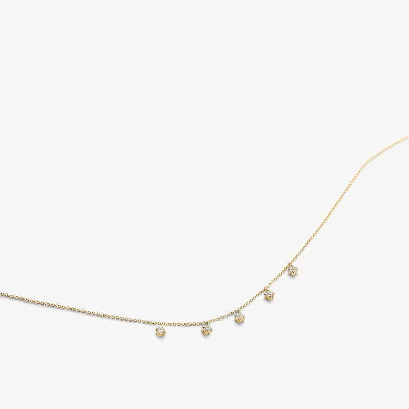Bicolor goud ketting met fijne schakels en hangende zirkonia's in 14k goud, wit en rosé.