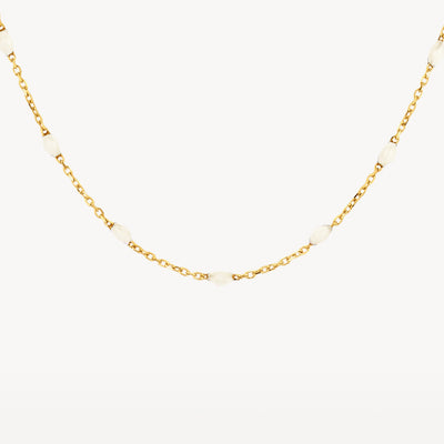 14k yellow gold chain with fine links and milk resin accents.