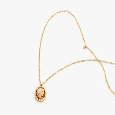 14k gold necklace with oval cameo pendant and fine chain link.