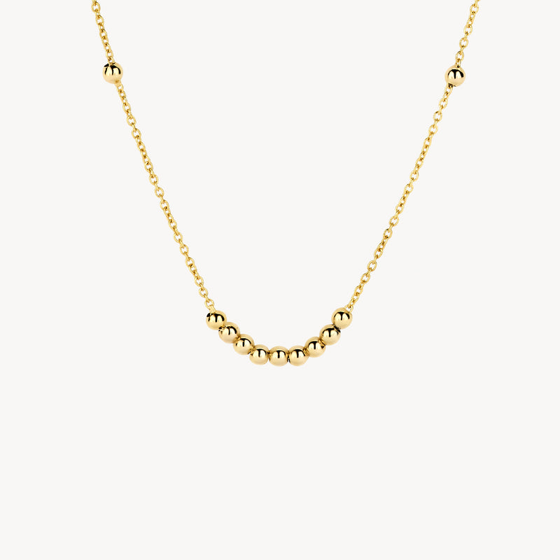 14k geelgouden ketting met glanzende bolletjes aan fijne schakels.
