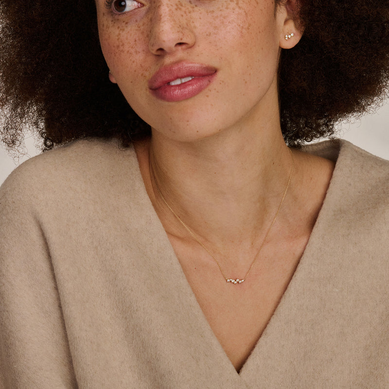 Bicolor gouden ketting met fijne schakels en zirkonia in 14k wit en rosé goud.