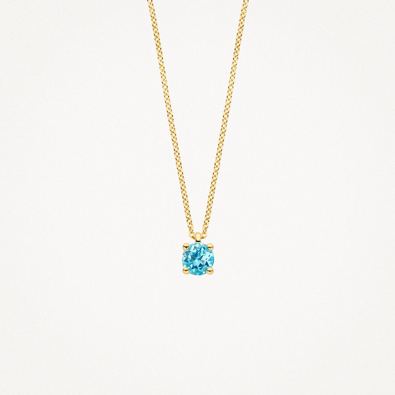Collier en or 14k avec pendentifs en topaze bleue ronde et chaîne à maillons fins.
