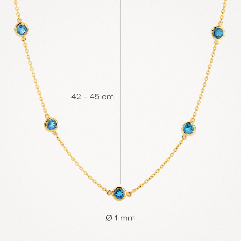 Collier en or jaune 14 carats serti d'une topaze « London Blue », d'une longueur de 42 à 45 cm.
