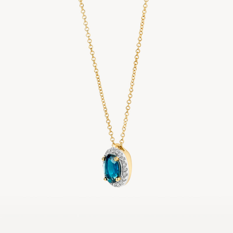 14k goud ketting met ovale Londen blauwe topaas en diamanten rand.