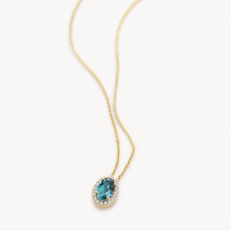 14k geel goud collier met ovale Londen blauwe topaas en diamanten omlijsting.