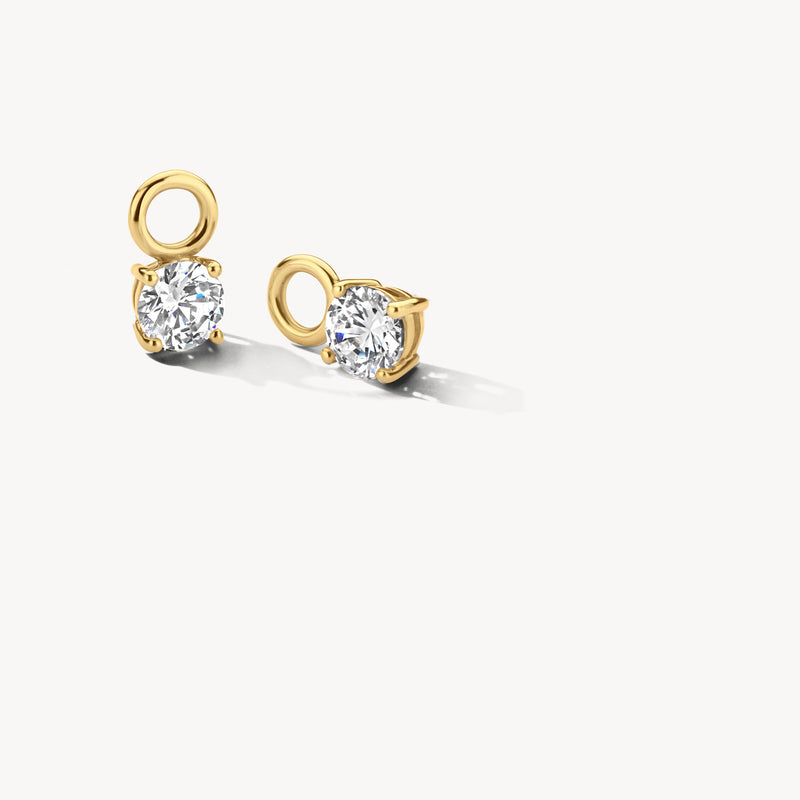 Geelgouden oorbedels met ronde zirkonia in 14k goud en subtiele glans.