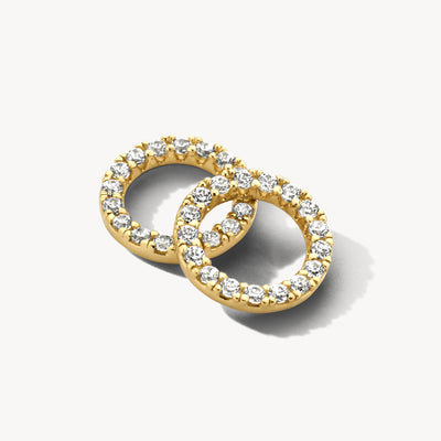 Oorbedels cirkelvormig 14k geelgoud met zirkonia rondom gezet.