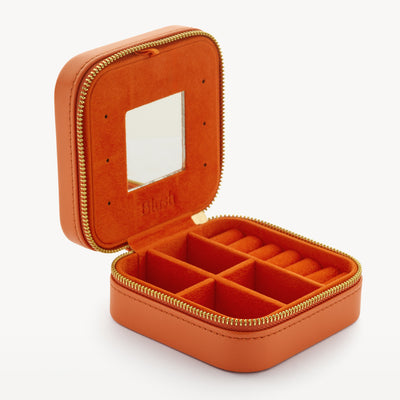 Oranje nappa reisetui met ritssluiting en vakverdeling voor sieraden en travelcase gebruik.