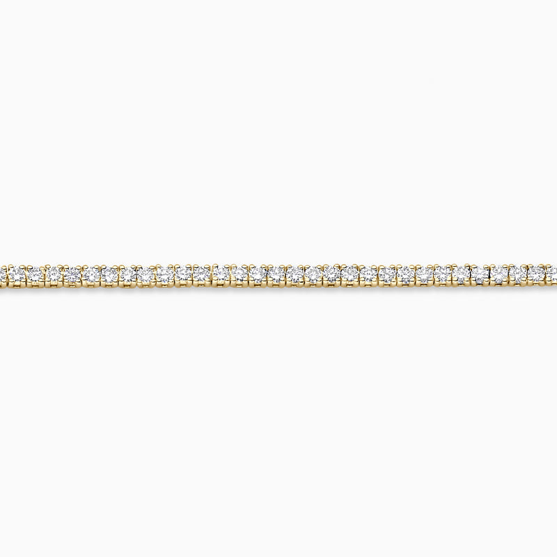 Lab grown diamanten tennisarmband van 14k geelgoud met ronde briljanten in rij, zijaanzicht.