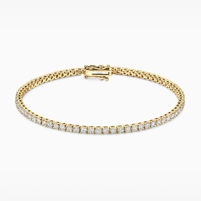 Bracelet from 14ct Yellow gold with row of lab diamonds and solid clasp.